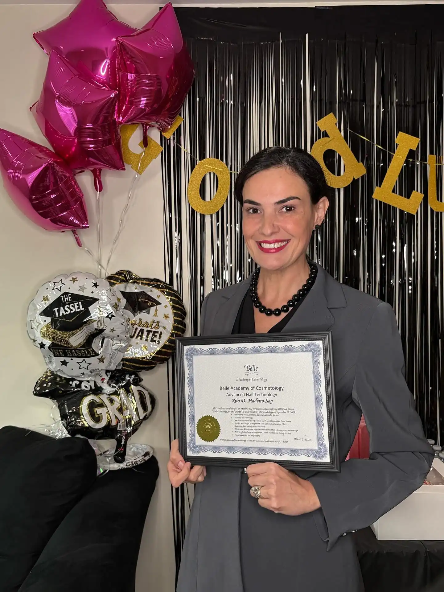 Belle Academy graduate celebrating with diploma