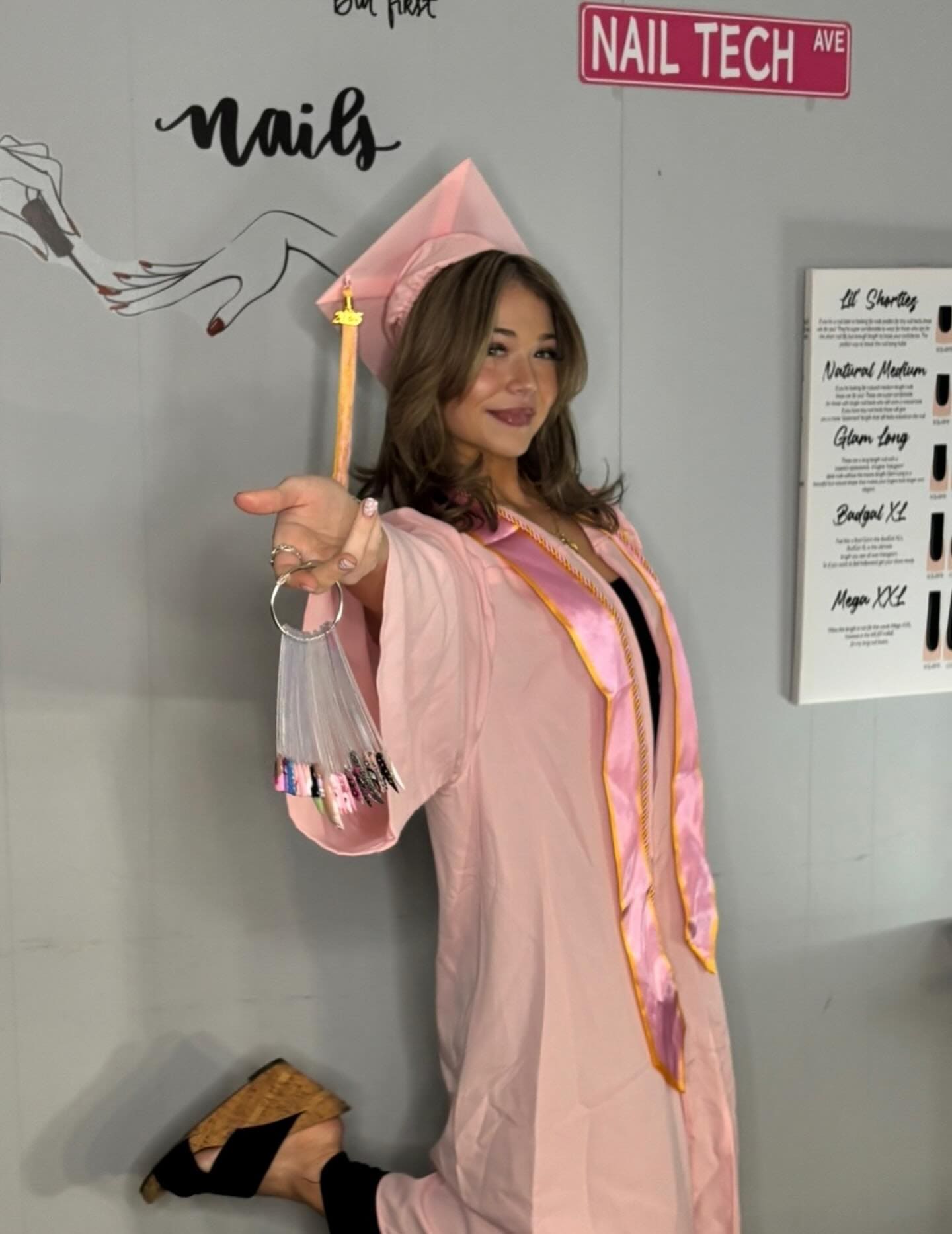 Belle Academy graduate celebrating with diploma
