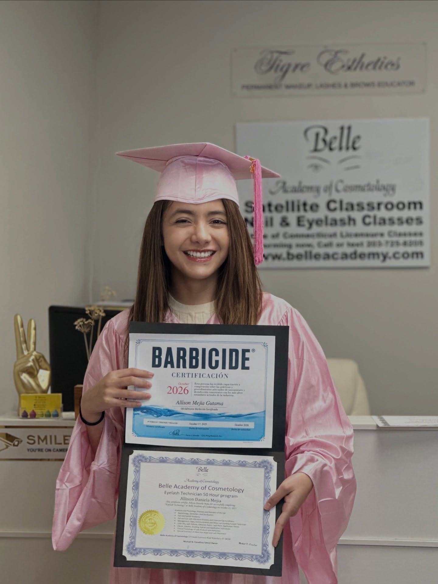 Barbicide certified Belle Academy graduate in pink gown