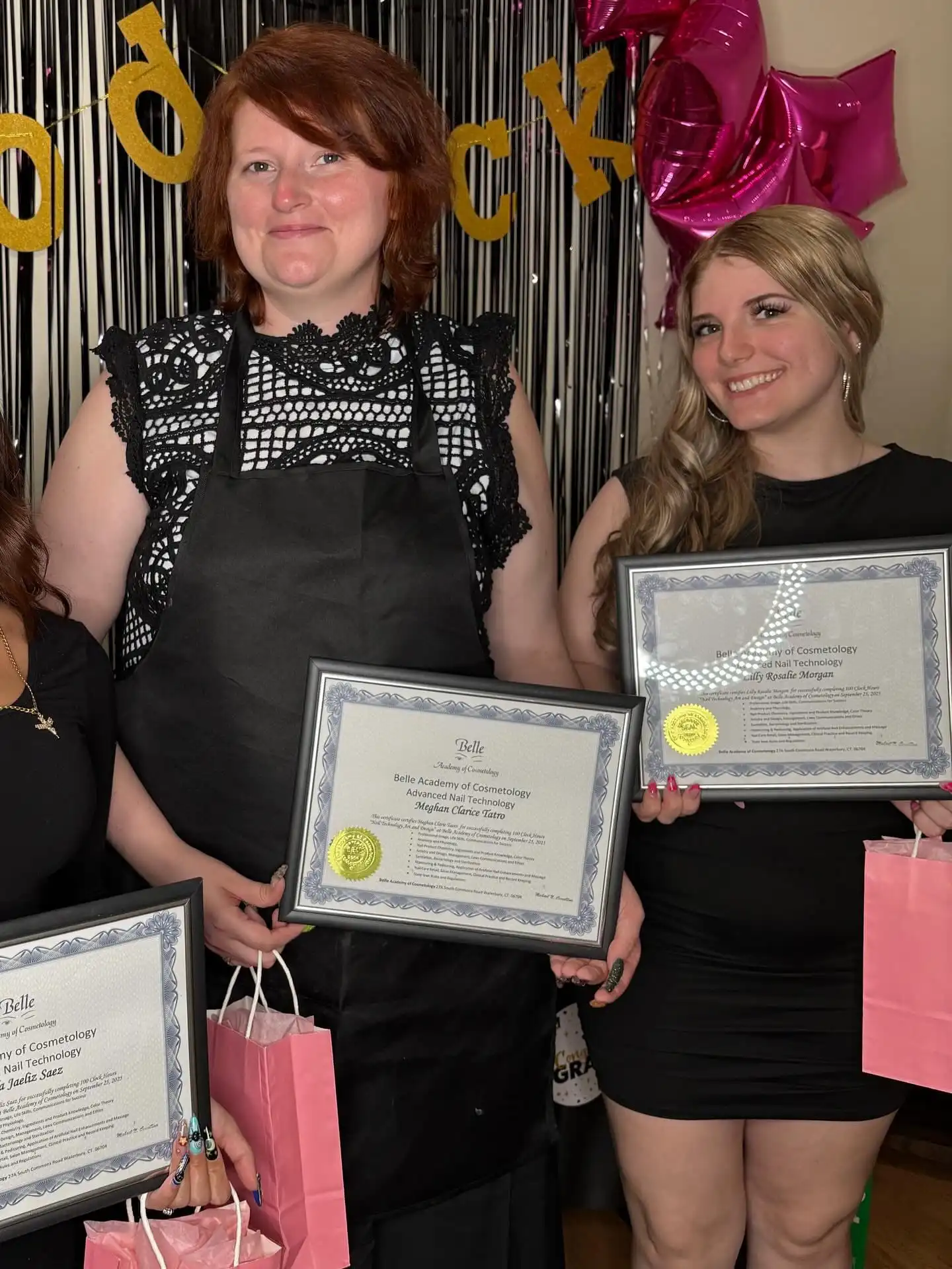 Belle Academy graduates with instructor holding certificates